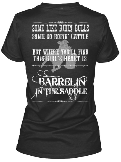 Some Like Ridin Bulls Some Go Ropin' Cattle But Where You'll Find This Girl's Heart Is Barrelin In The Saddle Black T-Shirt Back